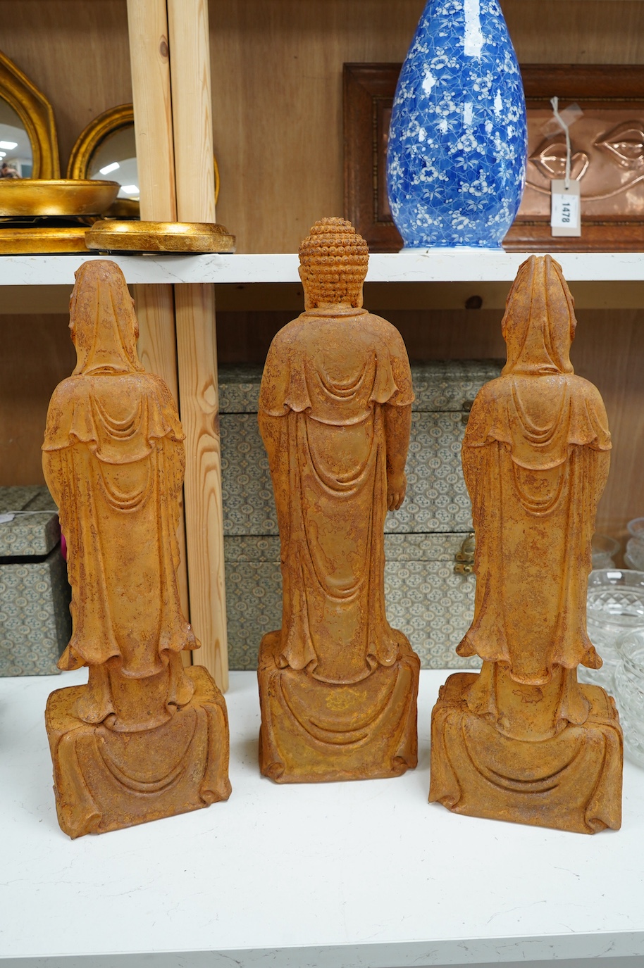 A set of three large Chinese patinated heavy glass figures of Bodhisattvas, tallest 49cm. Condition - good